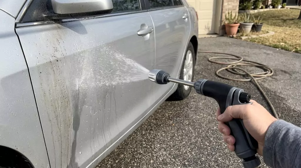 Power Blast Plus being used to wash a car — gentle but effective spray on a silver sedan